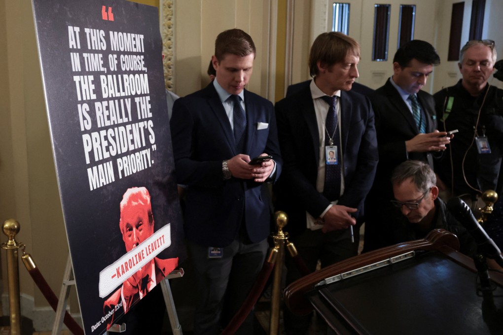 Reporters wait next to a poster featuring a quote attributed to White House Press Secretary Karoline Leavitt ahead of a press conference on Capitol Hill on Tuesday. Photo: Reuters