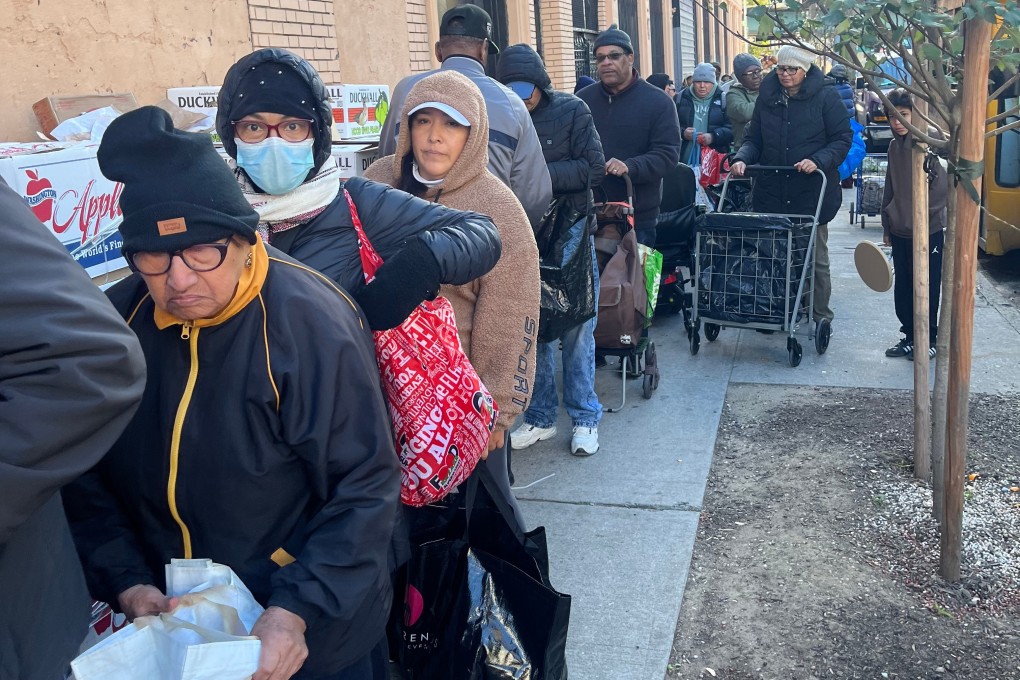 People wait in line for free food at the World of Life Christian Fellowship International food pantry in New York on Saturday. Photo: Reverend John Udo-Okon via AP