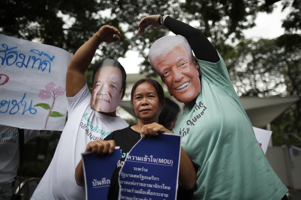 Thai demonstrators wearing masks of Thai Prime Minister Anutin Charnvirakul and US President Donald Trump protest against
a US-Thailand memorandum of understanding on rare earth minerals cooperation, outside the US Embassy in Bangkok, on October 30. Photo: EPA