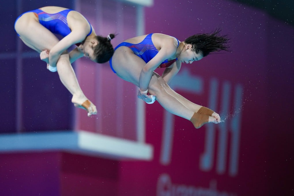 Quan Hongchan, right, and Wang Weiying helped Guangdong successfully defend the women’s team gold medal. Photo: Xinhua
