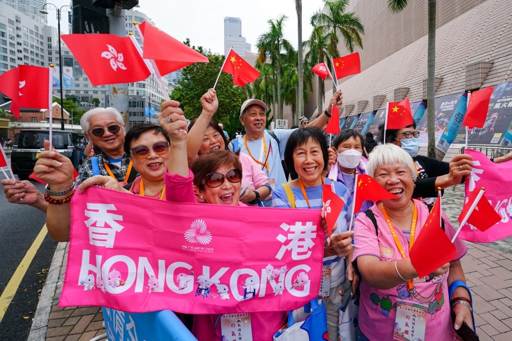 Excited spectators in Tsim Sha Tsui show their support for torch-bearers in Sunday’s relay. Photo: Felix Wong