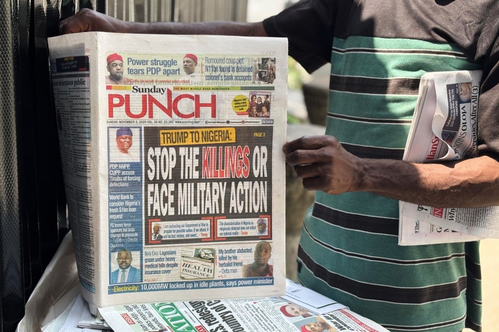 A vendor sells local newspapers with headlines referring to US President Donald Trump’s comments about Nigeria, on the street of Lagos, Nigeria, on Sunday. Photo: AP