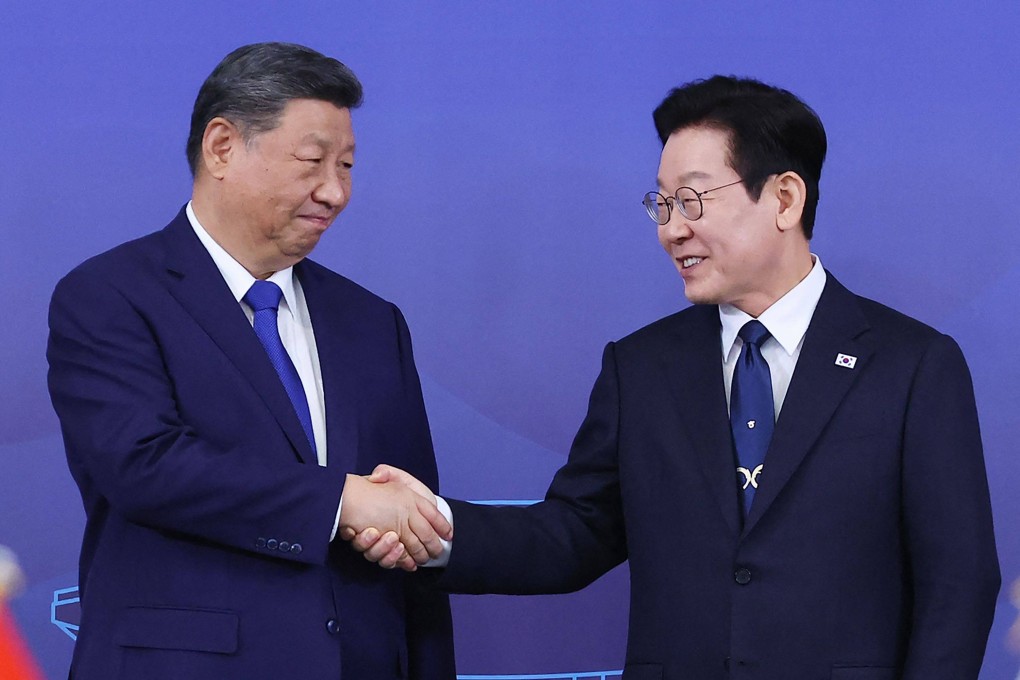 South Korea’s President Lee Jae-myung (right) and China’s leader Xi Jinping shake hands ahead of the South Korea-China summit held at the Gyeongju National Museum in Gyeongbuk Province on Saturday. Photo: Yonhap / AFP