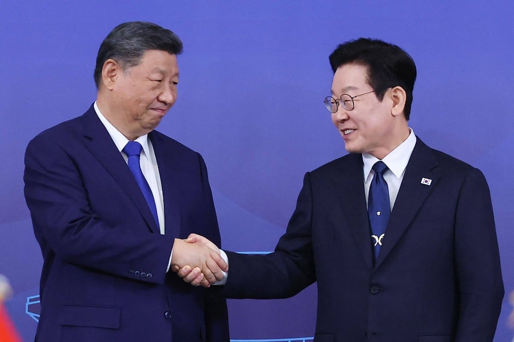 South Korea’s President Lee Jae-myung (right) and China’s leader Xi Jinping shake hands ahead of the South Korea-China summit held at the Gyeongju National Museum in Gyeongbuk Province on Saturday. Photo: Yonhap / AFP