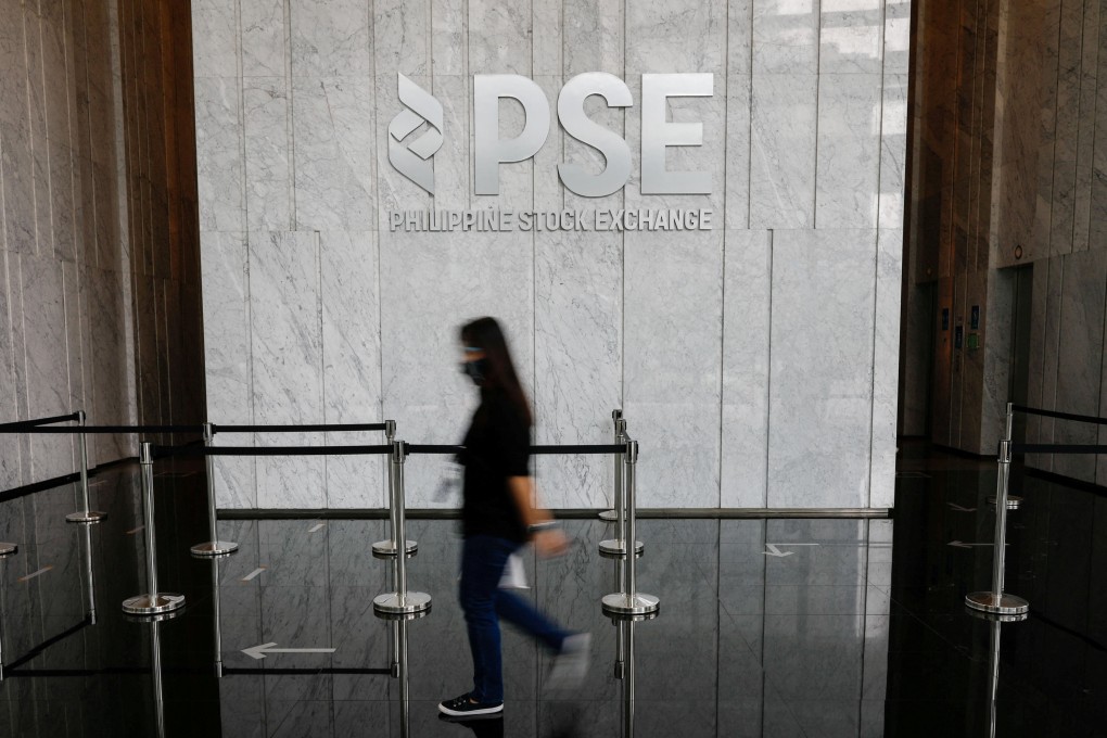 A woman walks in the lobby of the Philippine Stock Exchange in Taguig City, Metro Manila, Philippines. Photo: Reuters