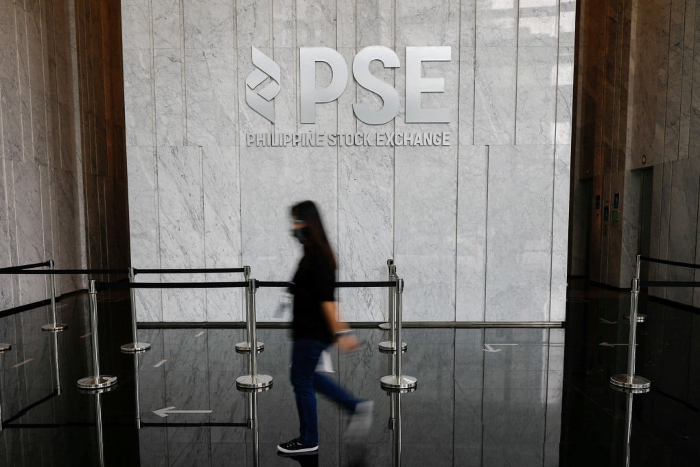 A woman walks in the lobby of the Philippine Stock Exchange in Taguig City, Metro Manila, Philippines. Photo: Reuters