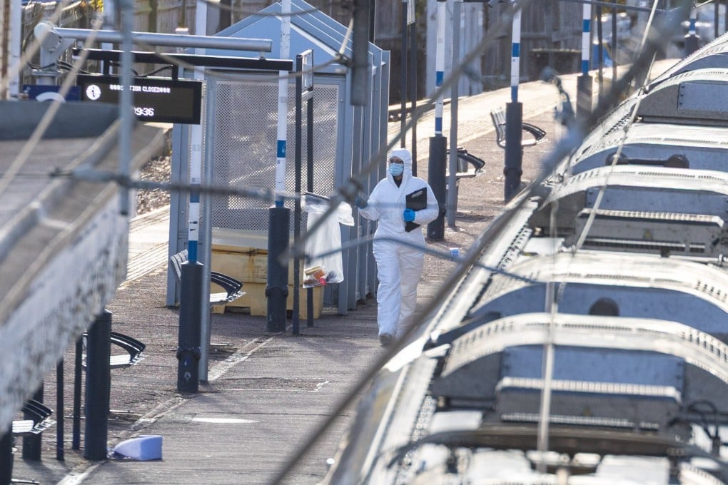 Forensic teams work at Huntington railway station on Sunday, where a London-bound train stopped after several people were stabbed on Saturday. Photo: EPA