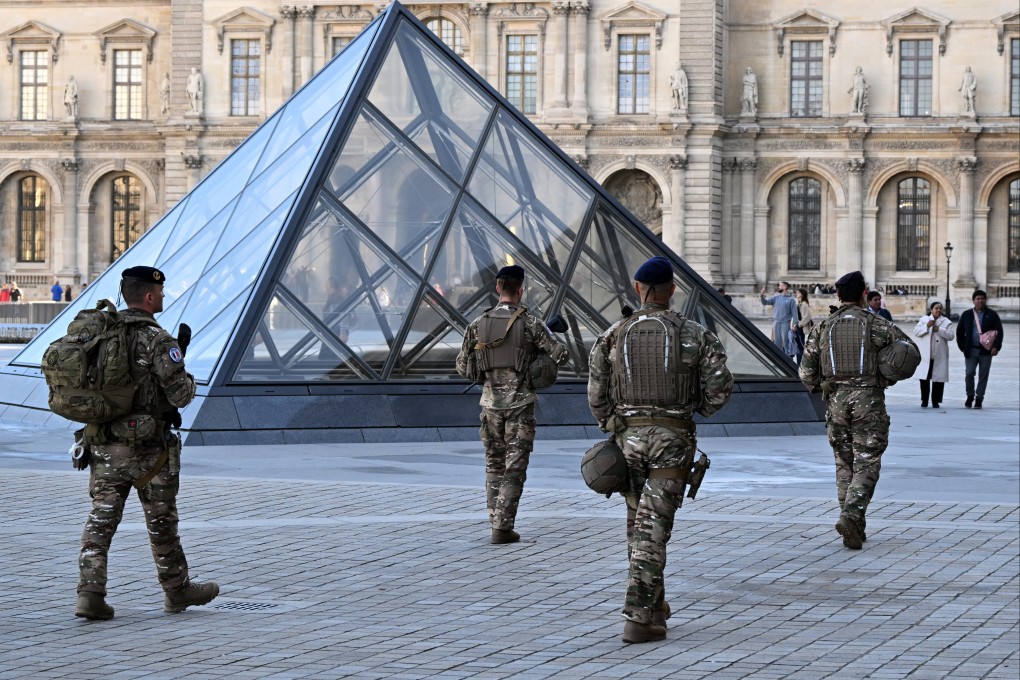 Soldiers patrol in the courtyard of the Louvre museum in Paris. Photo: AP