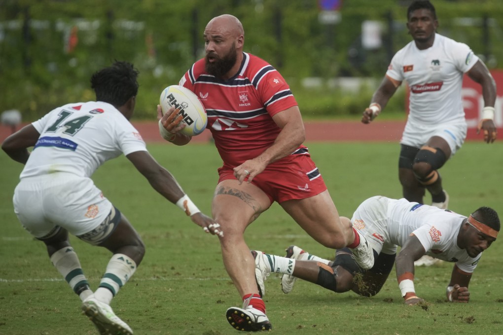 Hong Kong’s Luke van der Smit runs through the Sri Lanka defence during an Asia Rugby Championship clash at Kai Tak Youth Sports Ground. Photo: Sun Yeung