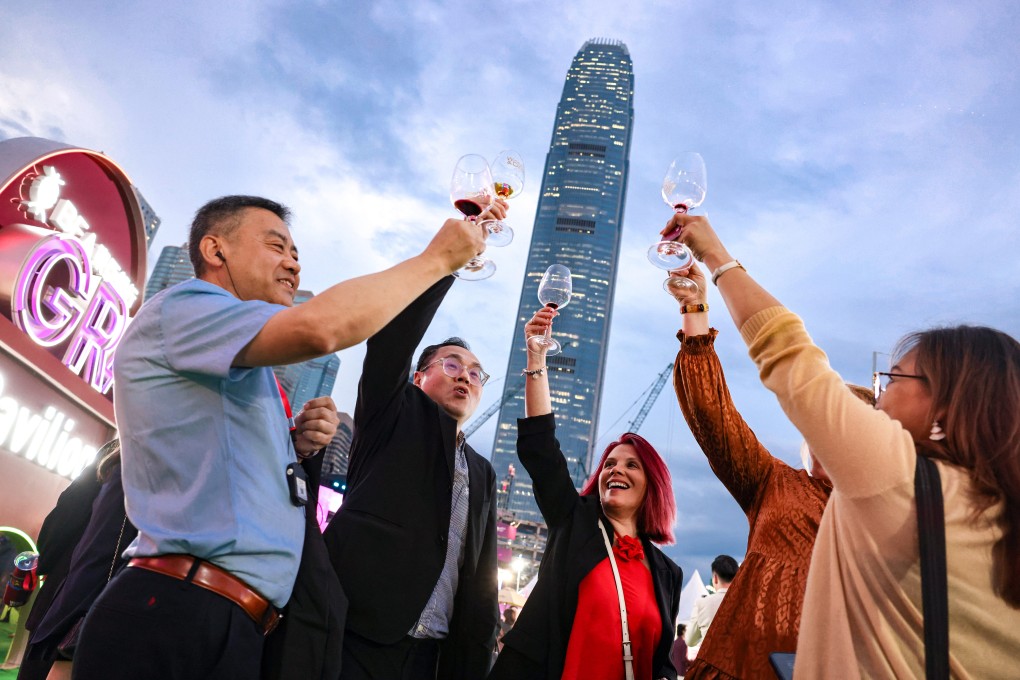 Revellers lift glasses as the Wine and Dine Festival at the Central Harbourfront Event Space on October 23. Photo: Nora Tam