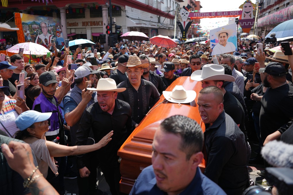 People carry the coffin of Carlos Alberto Manzo Rodríguez, who was shot during Day of the Dead celebrations. Photo: AP
