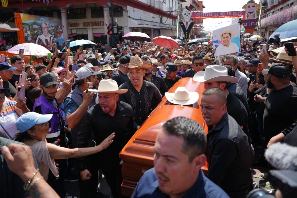 People carry the coffin of Carlos Alberto Manzo Rodríguez, who was shot during Day of the Dead celebrations. Photo: AP