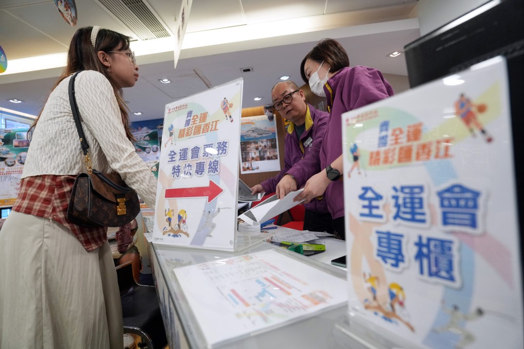 People buys tickets for the Games at China Travel Service’s branch in Causeway Bay. Photo: Sam Tsang