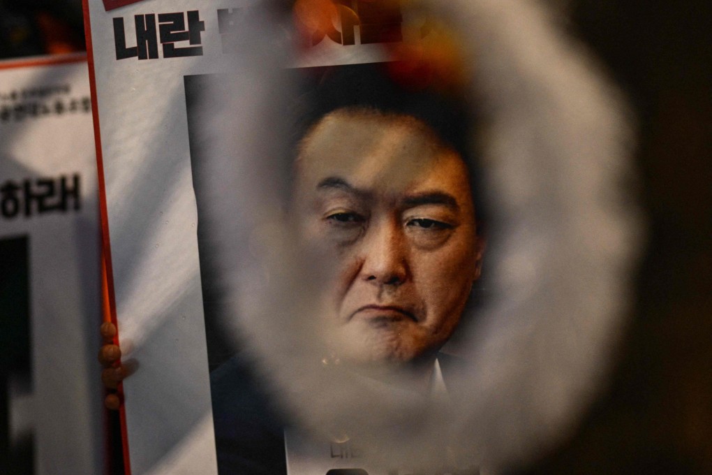 Posters displaying images of Yoon Suk-yeol calling for his ousting are seen in Seoul on December 5, 2024, days after his declaration of martial law. Photo: AFP
