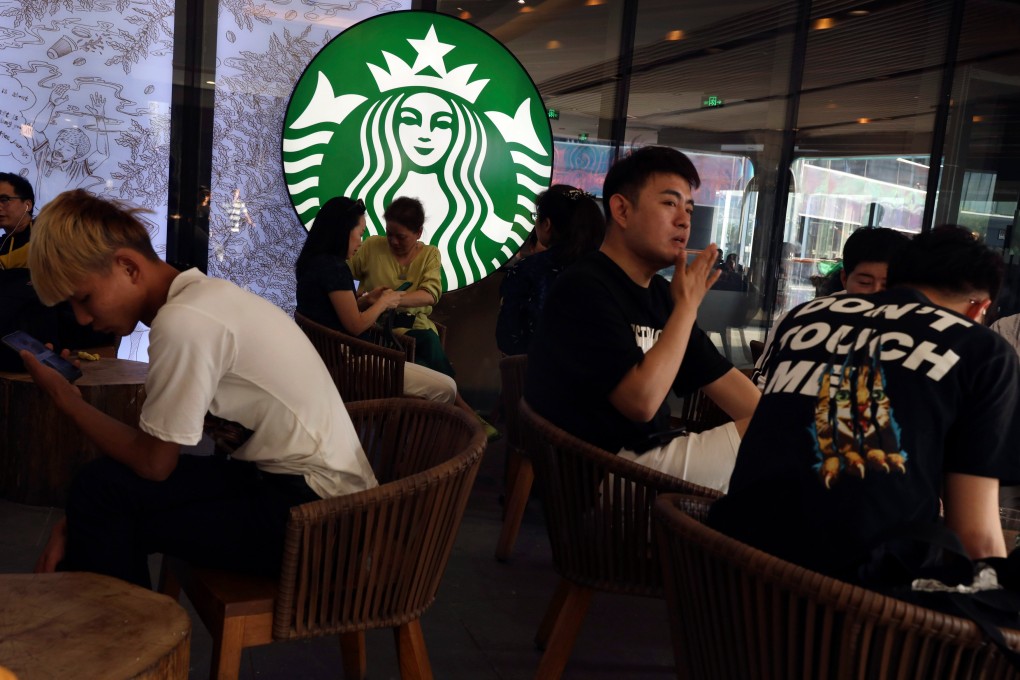 Customers sit in a Starbucks store in Beijing on May 10, 2019. Photo: AP Photo