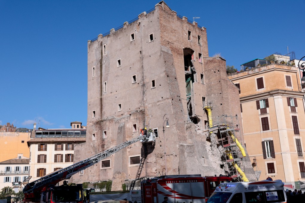 Emergency services at the scene after part of the Torre dei Conti tower collapsed near the Colosseum, in Rome. Photo: Reuters