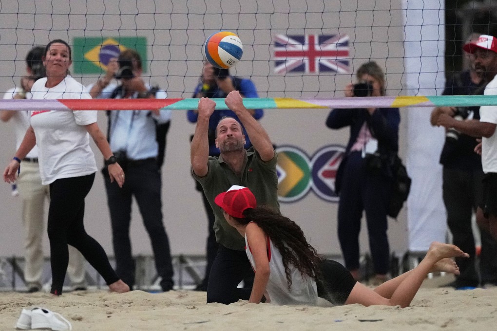 Prince William plays beach volleyball with youths on Copacabana beach in Rio de Janeiro on Monday. Photo: AP