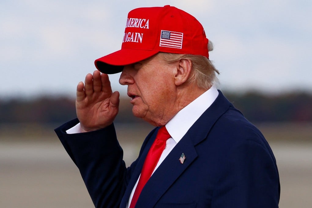 US President Donald Trump salutes after disembarking Air Force One. Photo: Reuters
