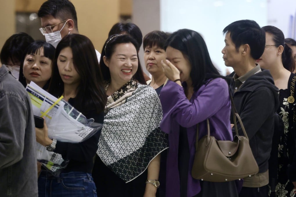 Homebuyers on Sunday stand in line at the sales office of Wheelock Properties’ Spring Garden residential project in Wan Chai. Photo: Jonathan Wong