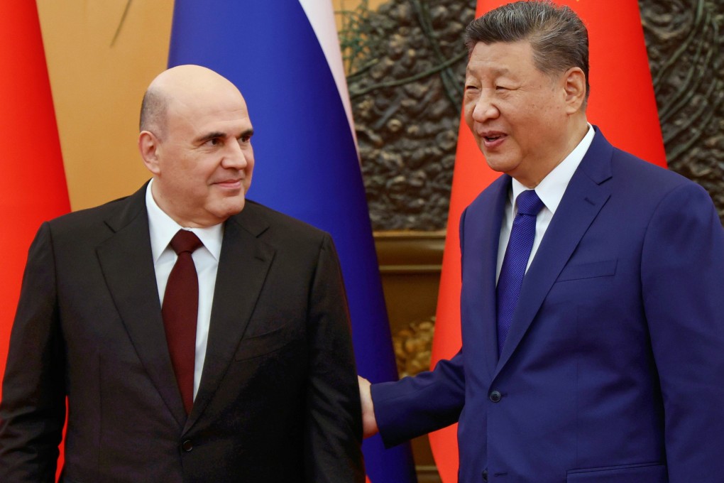 Chinese President Xi Jinping welcomes Russian Prime Minister Mikhail Mishustin for talks in Beijing on Tuesday. Photo: AP