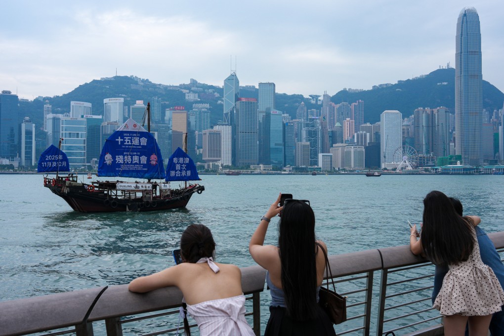 A junk boat with a poster promoting the 15th National Games sails through Victoria Harbour near Tsim Sha Tsui, on November 3. The games could highlight strengths or expose gaps in Hong Kong’s and other Greater Bay Area cities’ ability to host the Olympics. Photo: Jelly Tse