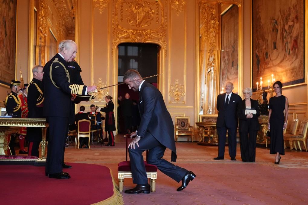 Sir David Beckham is made a Knight Bachelor by Britain’s King Charles III during an Investiture ceremony at Windsor Castle, Berkshire, England, Tuesday, Nov. 4, 2025. (Jonathan Brady/PA via AP)