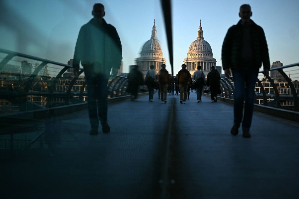 Commuters on the Millennium Bridge in London in March 2025. Researchers are finding that city strolls can be just as good for your mental health as walks in nature. Photo: AFP
