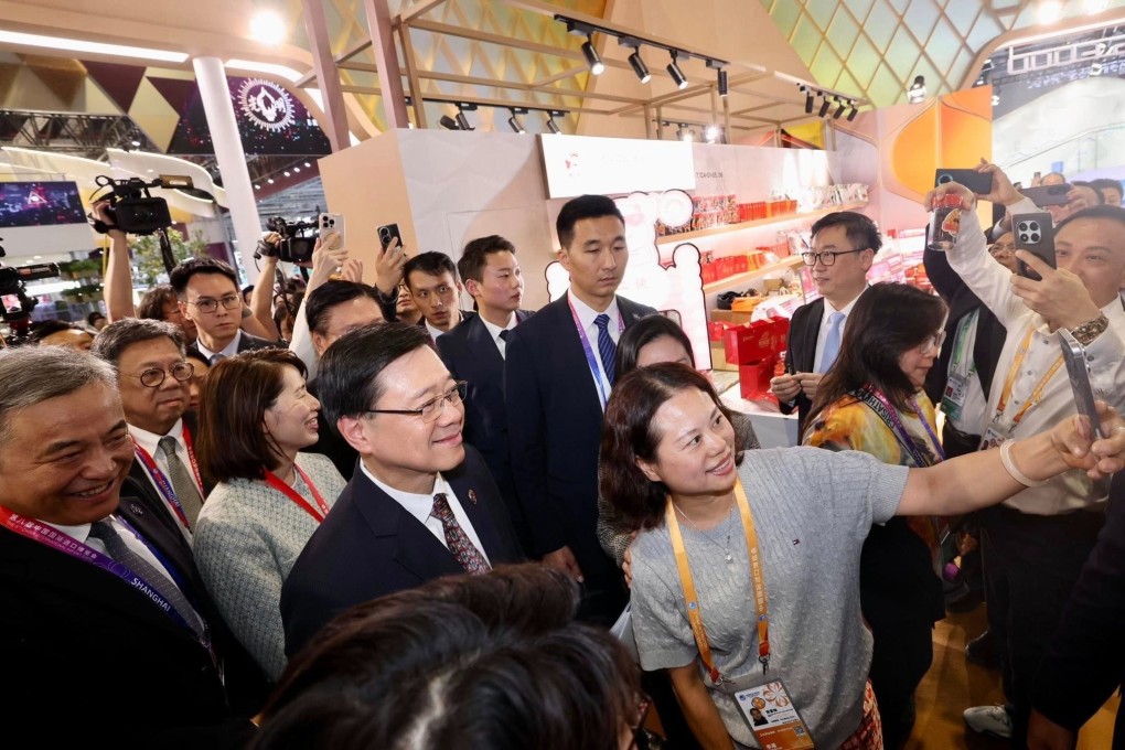 Time for a selfie as John Lee (centre) tours the China International Import Expo on Wednesday. Photo: Handout
