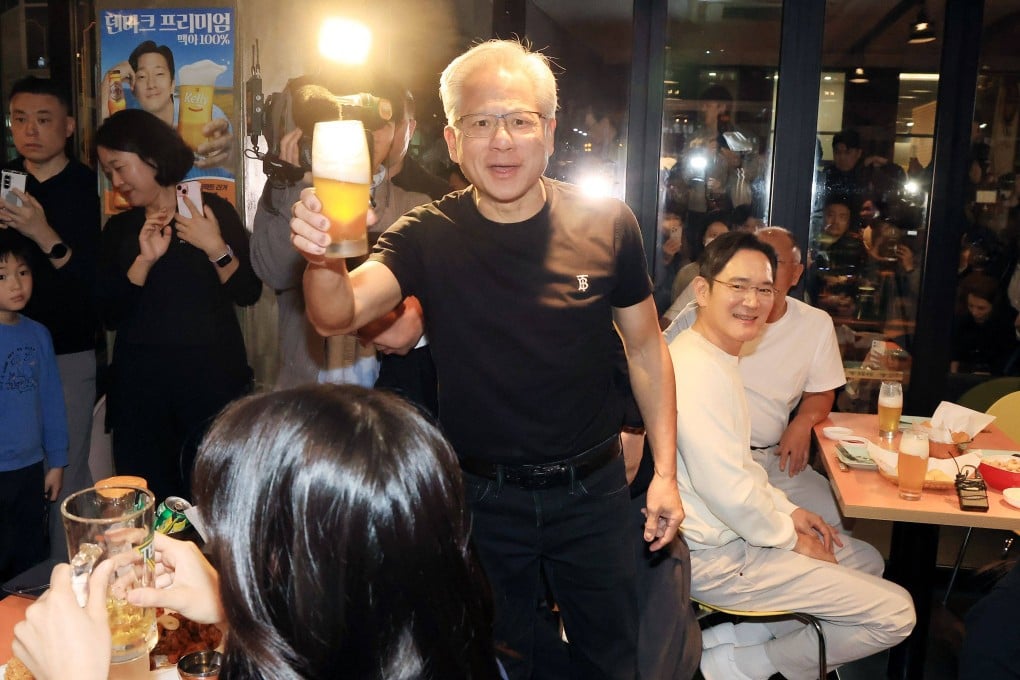 Nvidia CEO Jensen Huang poses with a beer at a fried chicken restaurant in Seoul on October 30. Photo: Yonhap/AFP