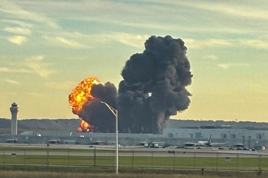 Smoke and flames rise from the site of a UPS cargo plane crash outside Louisville International Airport in Kentucky Tuesday. Photo: X/LeviDean98 via AFP
