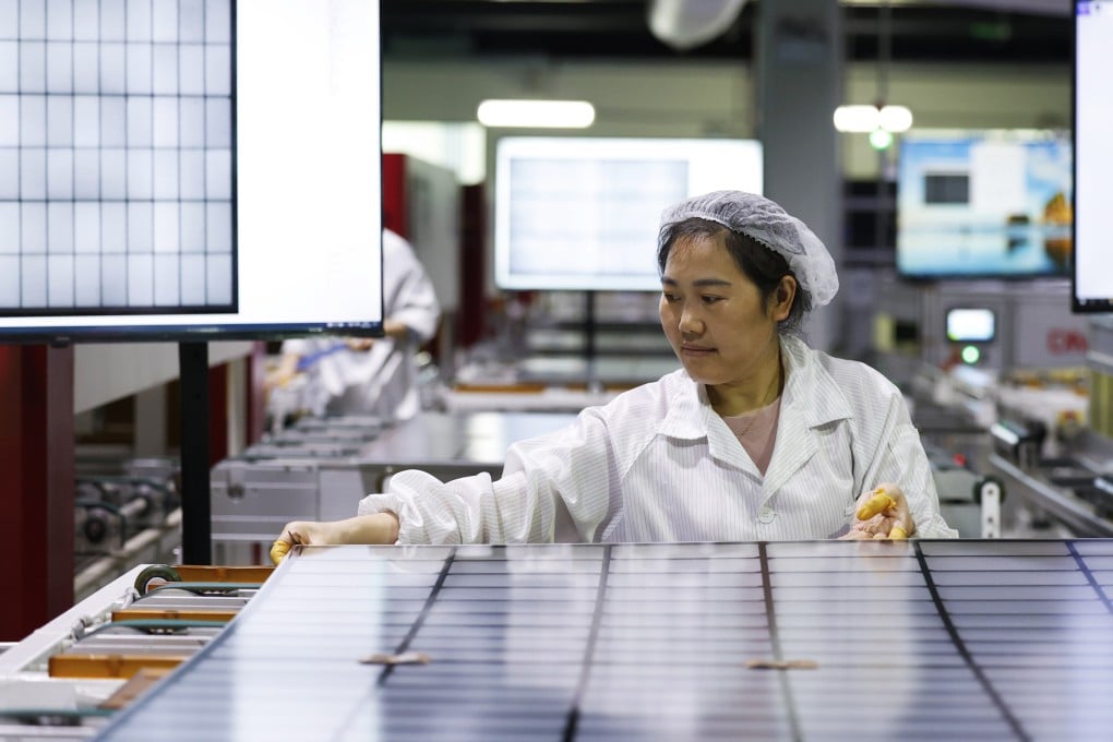 A worker makes a photovoltaic module at a factory in Suqian, Jiangsu province, on July 22. Photo: CFOTO / Future Publishing via Getty Images