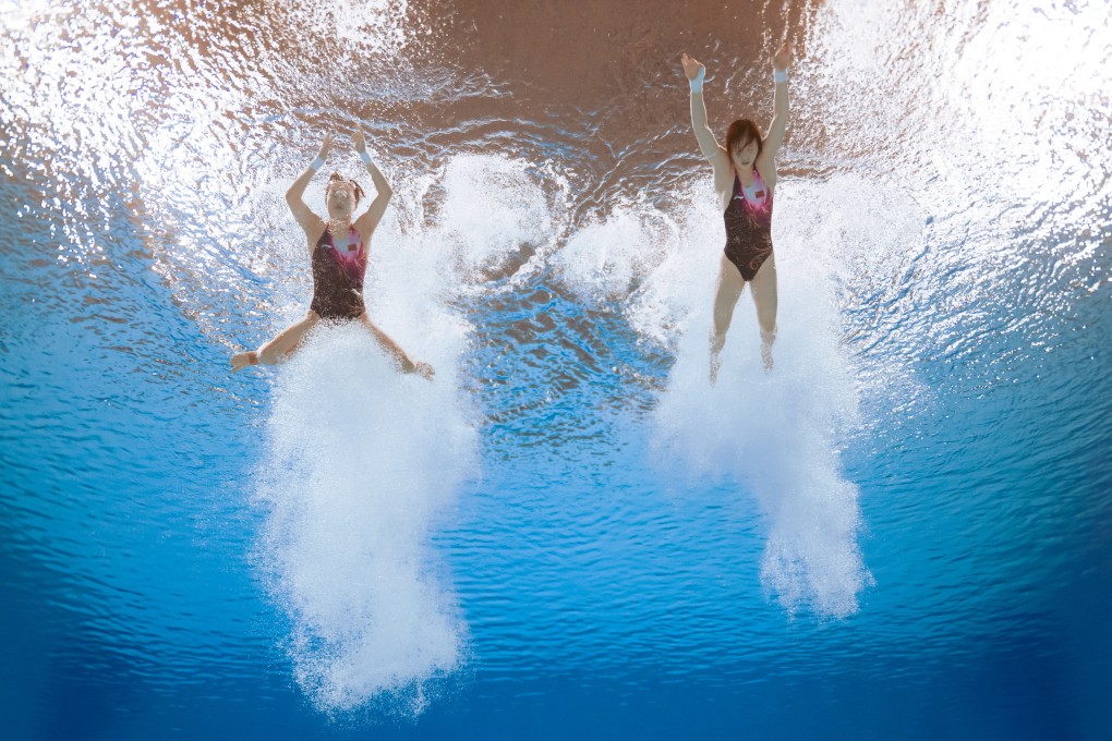 Shanghai’s Chen Yuxi and Zhang Minjie return to the surface after competing in the women’s synchronised 10-metre platform diving competition. Photo: Xinhua