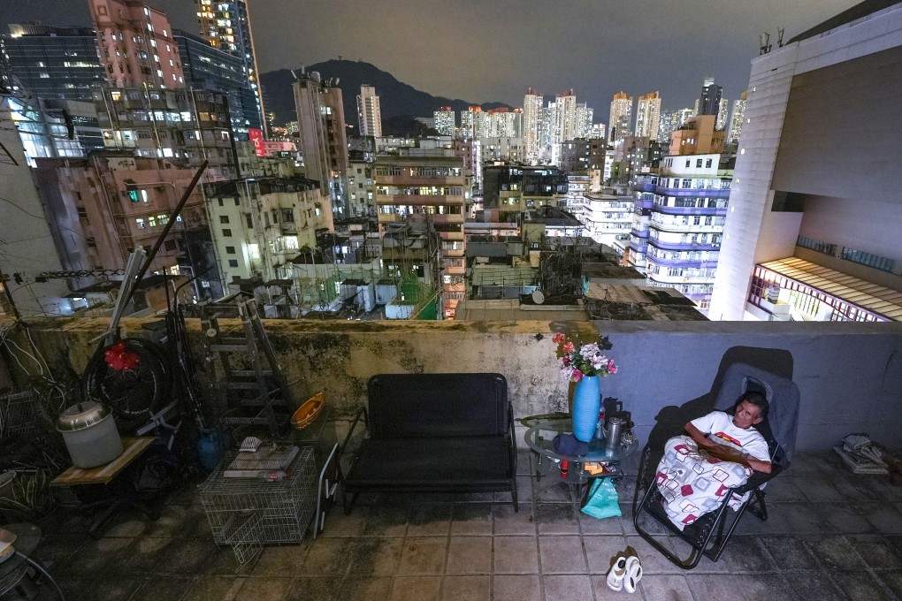 Chan relaxes outside his rooftop home in Sham Shui Po, in a photo that is part of an award-winning series. Photo: Eugene Lee