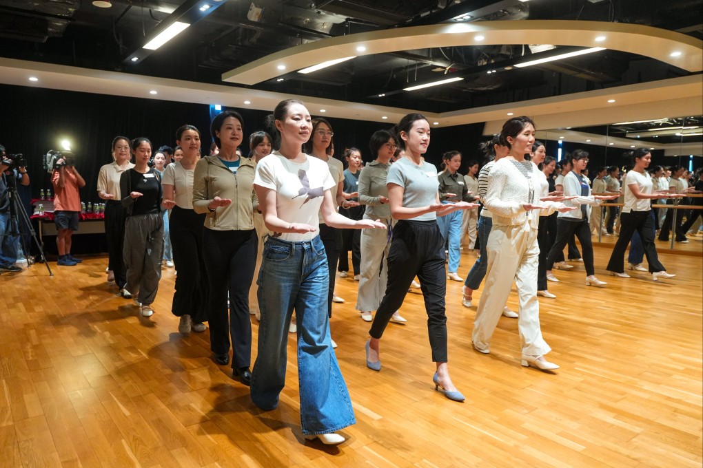Volunteers for the National Games were trained over three days on how to stand, sit and walk in specific ways as they were required to help with medal presentation ceremonies. Photo: Sun Yeung