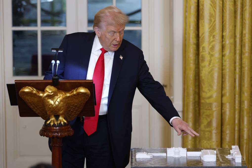 US President Donald Trump points to a model of the White House and proposed ballroom as he speaks during a ballroom fundraising dinner in the East Room of the White House on October 15. Photo: TNS