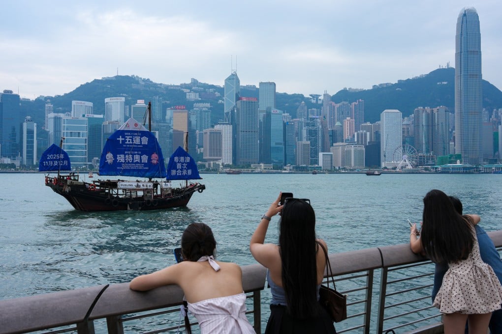 A Chinese sailboat with a giant poster for the 15th National Games and the Special Olympics sails through Victoria Harbour in Tsim Sha Tsui. Photo: Jelly Tse