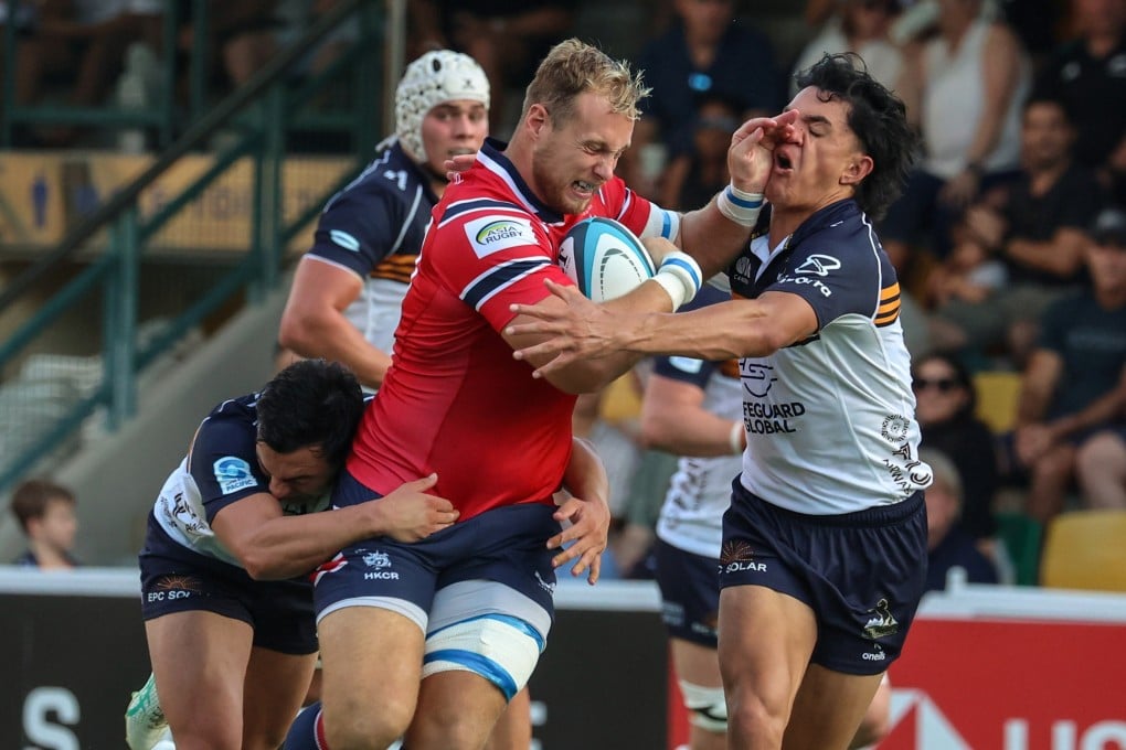 Hong Kong No 8 Jack Bartlett takes on the ACT Brumbies defence in their match at Football Club on Saturday. Photo: Edmond So