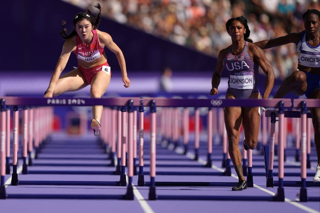 Wu Yanni (left) in round one of the 100m hurdles at the Paris Games, where she clocked China’s best time at the Olympics. Photo: Xinhua