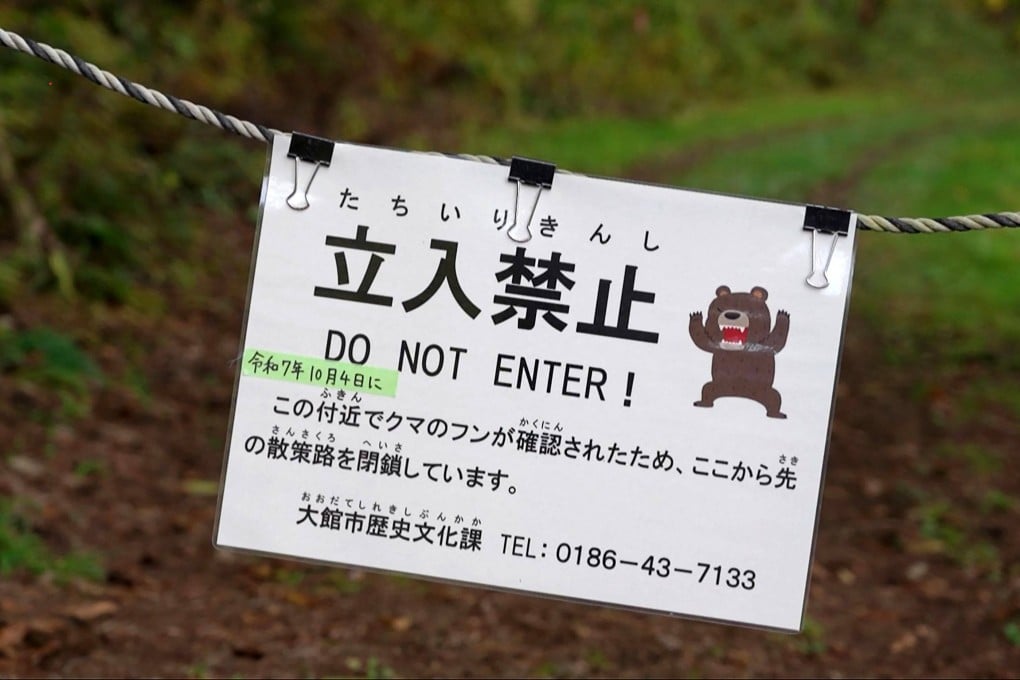 A sign warns visitors about bears in a forested area in Japan’s Akita prefecture on October 25. Photo: AFP