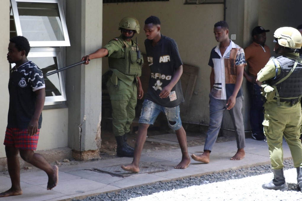 Tanzanians charged with treason for alleged involvement in last week’s violent protests arrive at the Kisutu Resident Magistrate’s Court in Dar es Salaam on Friday. Photo: Reuters
