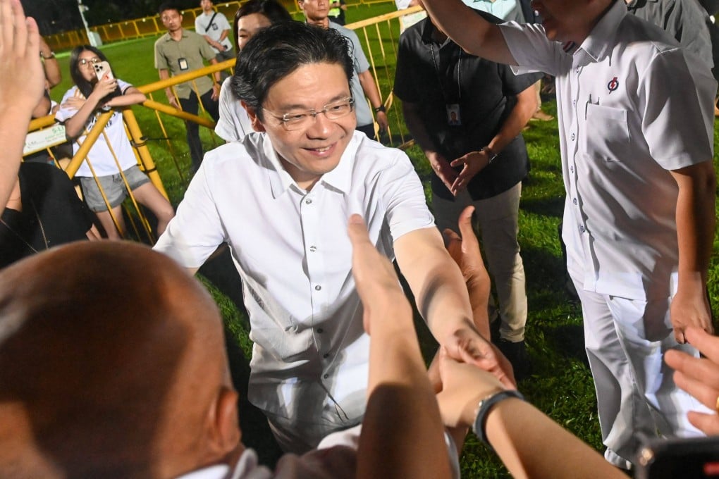 Singapore Prime Minister Lawrence Wong greets his supporters at the ruling party’s gathering centre during the general election results on May 3. Photo: AFP