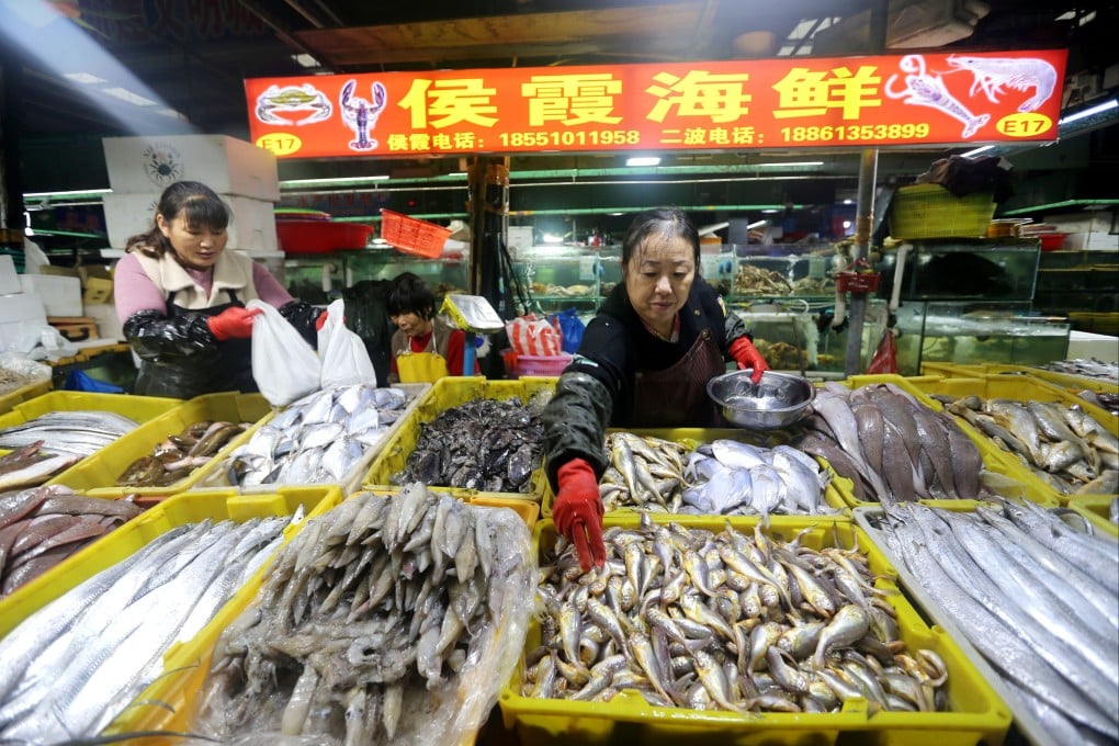 A vendor arranges seafood at a market in Lianyungang, Jiangsu province, last month. Photo: Xinhua
