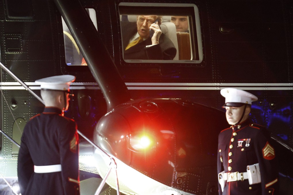 US President Donald Trump talks on his phone in Marine One on Friday, en route to his Mar-a-Lago estate in Palm Beach, Florida. Photo: AP