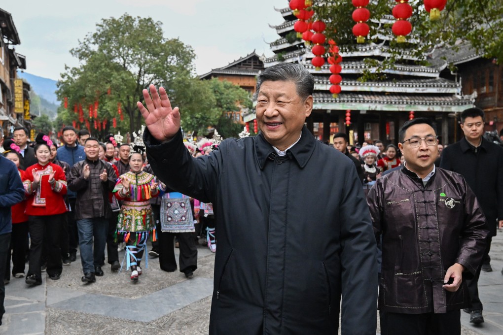 Chinese President Xi Jinping, who also serves as the Communist Party’s general secretary, waves goodbye to villagers while visiting Zhaoxing, Guizhou province, on March 17. Photo: Xinhua