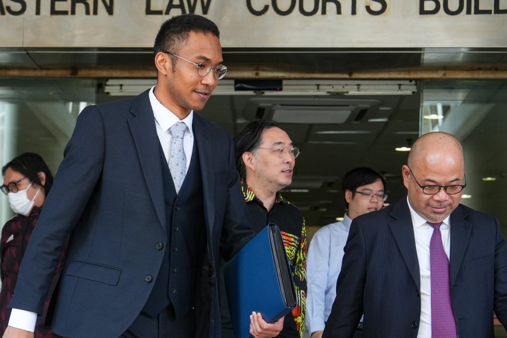 Brian Fok (in waistcoat) leaves Eastern Court in Sai Wan Ho. Photo: Sun Yeung