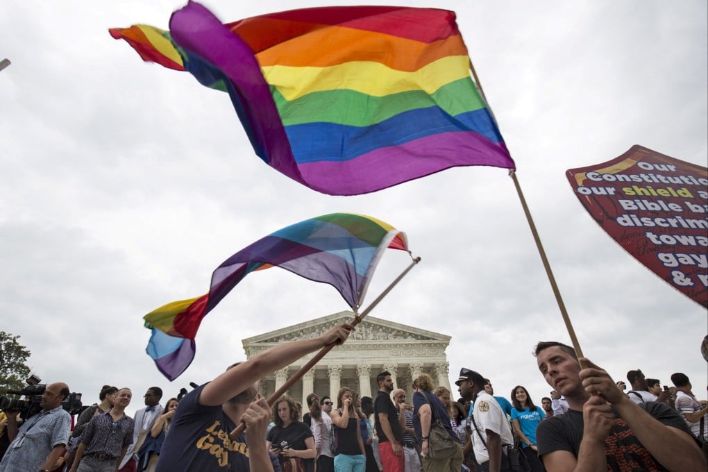 Supporters of gay marriage wave the rainbow flag outside the Supreme Court in Washington in 2015 after it ruled the U.S. Constitution provides same-sex couples the right to marry. Photo: Reuters
