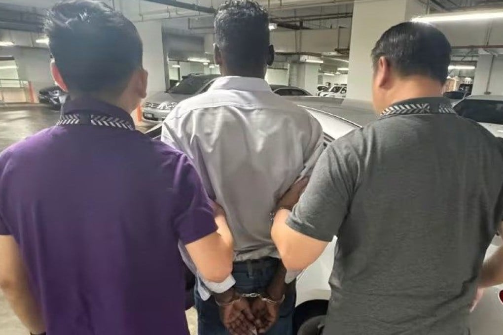 A Malaysian man is arrested on Saturday for allegedly being involved in a government official impersonation scam. Photo: Singapore Police Force