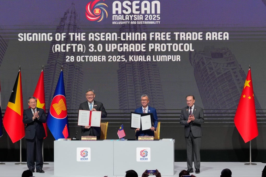 China’s Premier Li Qiang (far left) and Malaysia’s Prime Minister Anwar Ibrahim (far right), witness the signing ceremony for the Asean-China Free Trade Area 3.0 Upgrade Protocol by China’s Commerce Minister Wang Wentao and Malaysia’s Minister of Investment Abdul Aziz in Kuala Lumpur, Malaysia, on Octover 28. Photo: AP