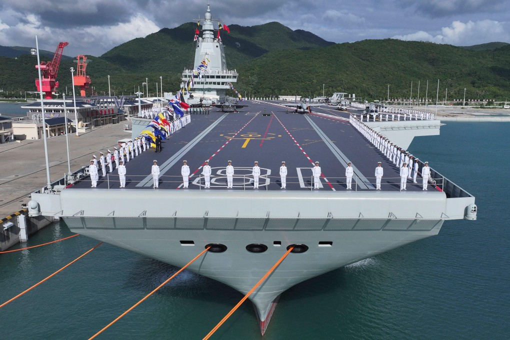 A commissioning and flag-presenting ceremony is held for the Fujian, China’s third aircraft carrier and the first that it has both designed and built itself equipped with electromagnetic catapults, at a naval port in Sanya in southern Hainan province, on November 5. Photo: AP