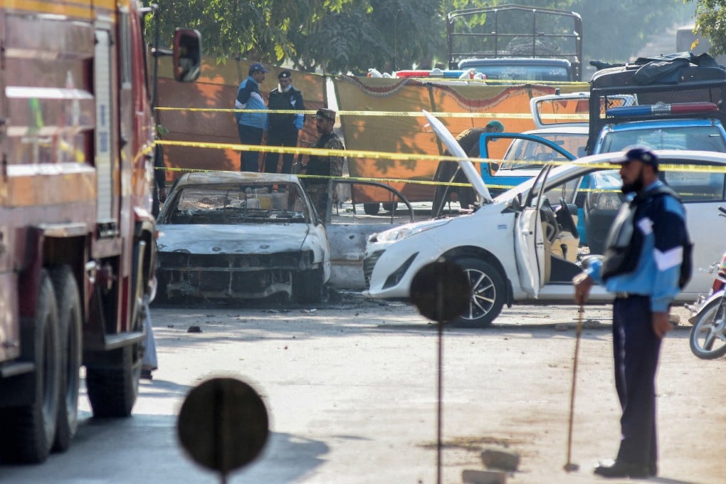 A police officer stands at the site of a blast outside a court building in Islamabad, Pakistan on Tuesday. Photo: Reuters